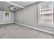 Spacious bedroom with neutral walls, plush carpeting, and ample natural light from multiple windows at 2215 Suffolk St, North Charleston, SC 29405