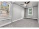 Inviting bedroom with gray walls, neutral carpet, and natural light from large windows at 2215 Suffolk St, North Charleston, SC 29405