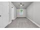 Cozy bedroom featuring gray walls, neutral carpet, and a ceiling fan for added comfort at 2215 Suffolk St, North Charleston, SC 29405