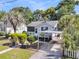 Charming single-story home with a well-maintained lawn, mature trees, and convenient covered parking at 2215 Suffolk St, North Charleston, SC 29405