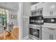 Modern kitchen with stainless steel appliances and view into the dining room at 2215 Suffolk St, North Charleston, SC 29405