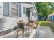 Outdoor patio with dining set and access to a small shed in the backyard at 2215 Suffolk St, North Charleston, SC 29405