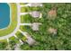 Aerial view of homes with ponds and dense green trees at 233 Camber Rd, Huger, SC 29450