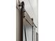 Close up of a modern farmhouse barn door, showcasing the metal sliding hardware at 233 Camber Rd, Huger, SC 29450