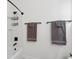 Bathroom featuring a white tub, shower stall and towel racks at 233 Camber Rd, Huger, SC 29450