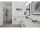 Bathroom featuring a soaking tub, glass shower, granite countertop, and modern fixtures, perfect for relaxation and convenience at 233 Camber Rd, Huger, SC 29450