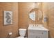Charming powder room featuring unique wall texture, elegant mirror, and stylish fixtures, adding character and charm at 233 Camber Rd, Huger, SC 29450