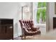 Comfortable bedroom seating area with a leather chair and a window with a view at 233 Camber Rd, Huger, SC 29450