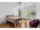 Bright bedroom boasts hardwood floors, a ceiling fan, and a view of the outdoors at 233 Camber Rd, Huger, SC 29450