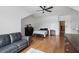 Bright bedroom boasts an ensuite bathroom, hardwood floors, and a large black dresser at 233 Camber Rd, Huger, SC 29450