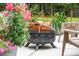A cozy fire pit surrounded by lush greenery sets the scene for outdoor enjoyment at 233 Camber Rd, Huger, SC 29450