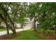 Charming two-story home with well-manicured lawn, two-car garage and a hammock at 233 Camber Rd, Huger, SC 29450