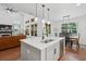 Kitchen island featuring a sink and dining table with chairs in an open-concept room at 233 Camber Rd, Huger, SC 29450