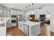 Open kitchen featuring a large island, stainless steel appliances, and hardwood floors at 233 Camber Rd, Huger, SC 29450