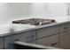 Contemporary kitchen featuring a gas cooktop and white countertops with dark cabinets pulls at 233 Camber Rd, Huger, SC 29450
