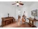 Well-lit formal living room with hardwood floors and piano at 233 Camber Rd, Huger, SC 29450