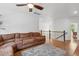 Open living area featuring a plush sectional sofa, wood floors, and an airy ambiance at 233 Camber Rd, Huger, SC 29450