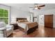 Cozy main bedroom with hardwood floors, natural light, and neutral color palette at 233 Camber Rd, Huger, SC 29450
