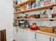 Spacious pantry with wood shelving, ample storage, and white cabinetry at 233 Camber Rd, Huger, SC 29450