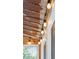 Close-up of the patio ceiling with string lights creating a warm and inviting ambiance for outdoor gatherings and relaxation at 233 Camber Rd, Huger, SC 29450