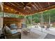 Inviting screened patio with comfortable seating and views of the backyard, creating a peaceful outdoor living space at 233 Camber Rd, Huger, SC 29450
