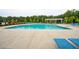 Community swimming pool featuring zero entry and multiple chairs with umbrellas at 233 Camber Rd, Huger, SC 29450