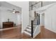 Staircase with wood treads and black wrought iron spindles leading to upper level at 233 Camber Rd, Huger, SC 29450