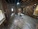 Stripped interior showing wood beams, exposed framing, studs, wood floors, and room layout at 2334 Kent Ave, North Charleston, SC 29405