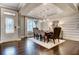 Elegant dining room featuring modern lighting, hardwood floors, and stylish furnishings for formal dining at 265 Huguenot Trl, Huger, SC 29450