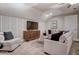 Cozy living area featuring neutral tones, modern furniture, and ample seating at 265 Huguenot Trl, Huger, SC 29450