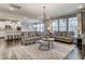 Open-concept living room seamlessly connects to the kitchen, offering a spacious and modern living area at 265 Huguenot Trl, Huger, SC 29450