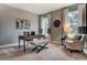 Stylish home office with a modern desk, comfortable seating, and natural light from large windows at 265 Huguenot Trl, Huger, SC 29450