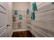 Walk-in pantry offers ample storage with wire shelving and is conveniently located near the kitchen at 265 Huguenot Trl, Huger, SC 29450