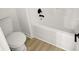 Bright bathroom featuring a tub with black fixtures and wood look flooring at 3013 Argyll Dr, Summerville, SC 29483