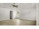 Large bedroom with light-colored wood-look floors, tray ceilings, and neutral walls at 3013 Argyll Dr, Summerville, SC 29483