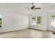 Large bright bedroom with tray ceiling and fan fixture; with views to the outside at 3013 Argyll Dr, Summerville, SC 29483