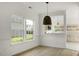 Bright dining room with view of the backyard and open to a renovated kitchen at 3013 Argyll Dr, Summerville, SC 29483