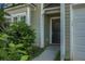 Close up of a home's front door, showing the siding, the front door, and the lawn beside the entrance at 3013 Argyll Dr, Summerville, SC 29483