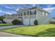 Exterior of a two-story home with a two-car garage, well-manicured lawn, and mature bushes in the front yard at 3013 Argyll Dr, Summerville, SC 29483