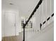 Foyer with staircase featuring black banisters, white spindles, light wood floors and lots of natural light at 3013 Argyll Dr, Summerville, SC 29483