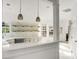 Modern kitchen with white counter and view into dining and living areas at 3013 Argyll Dr, Summerville, SC 29483