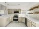 Well-lit renovated kitchen featuring modern appliances and open shelving at 3013 Argyll Dr, Summerville, SC 29483