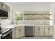 Modern kitchen featuring marble countertops, wood shelving, and stainless appliances at 3013 Argyll Dr, Summerville, SC 29483