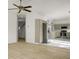 Open living room with ceiling fan transitions to a kitchen with stainless steel appliances and marble countertops at 3013 Argyll Dr, Summerville, SC 29483