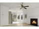 Open concept featuring living room with fireplace, ceiling fan transitions to modern kitchen with stainless appliances at 3013 Argyll Dr, Summerville, SC 29483