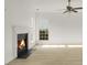 Bright living room includes fireplace, ceiling fan and lots of light coming from large windows at 3013 Argyll Dr, Summerville, SC 29483