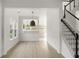 Open-concept living area with light-filled kitchen and stairway at 3013 Argyll Dr, Summerville, SC 29483