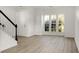 Bright, white living room with natural light and wood-look flooring at 3013 Argyll Dr, Summerville, SC 29483