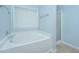 Bathroom with a bright window above the large, white tub, next to a glass-door shower at 309 Hathaway Dr, Goose Creek, SC 29445