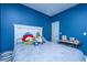 Cozy bedroom with navy blue walls, a white headboard, and a collection of plush toys at 309 Hathaway Dr, Goose Creek, SC 29445